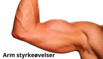 Billedet viser en muskuløs, bøjet arm med tydelige årer og veldefinerede muskler. Armen er fotograferet mod en hvid baggrund. Nederst på billedet står teksten: "Arm styrkeøvelser".
