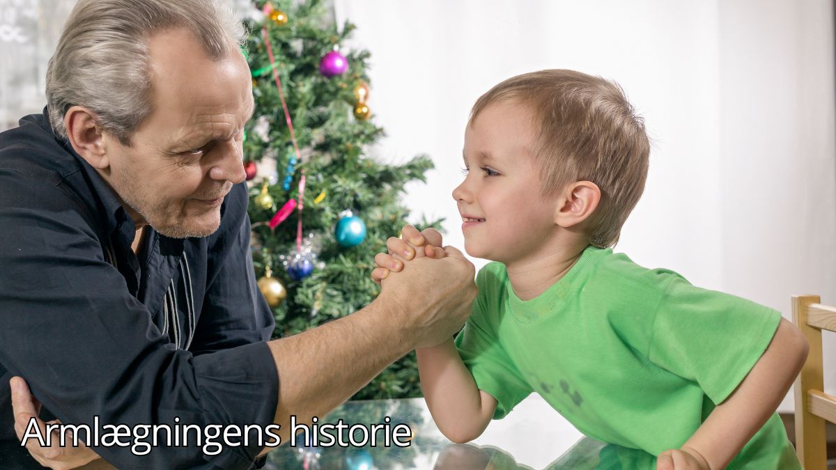 Billedet viser en ældre mand og et barn, der hygger sig med en venlig armlægningskonkurrence ved et bord. Det symboliserer armlægning som en tidløs aktivitet, der binder generationer sammen gennem leg og konkurrence. Billedetekst: "Armlægningens historie''